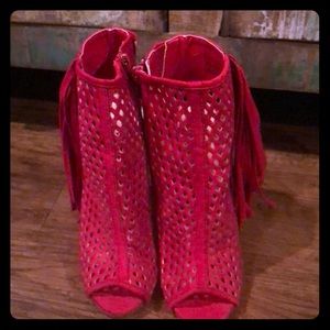 Red tassel heels